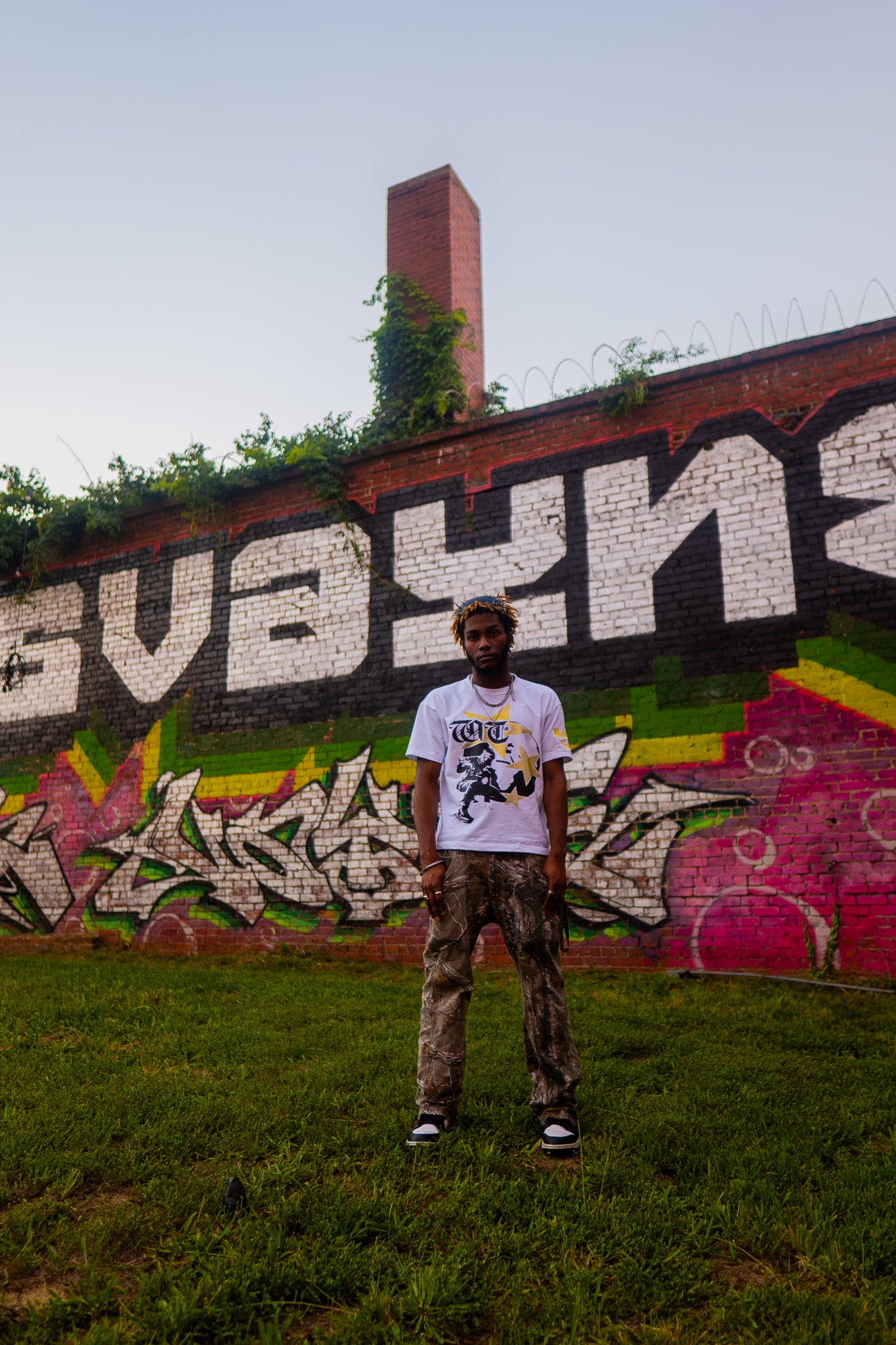 Yellow "Global Assassin" Rhinestone Tee